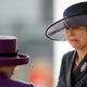 British Prime Minister Theresa May reacts to the Queen in October of 2018
